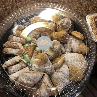 a variety of donuts in a tray