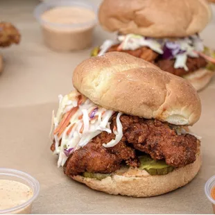a chicken sandwich with coleslaw slaw