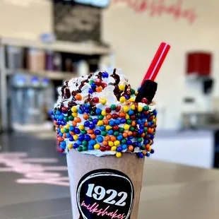 a cup of ice cream with sprinkles