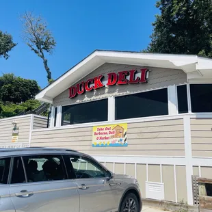 Look for this sign. Park here. Holy Cow is in the backyard.