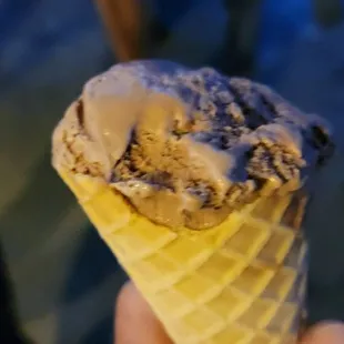 Chocolate ice cream in a waffle cone