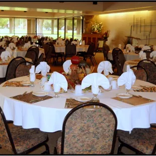 a dining room with tables and chairs