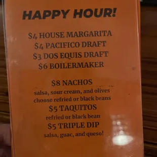 Happy hour menu posted at the bar