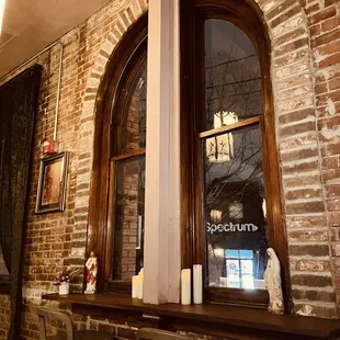 the reflection of a candle in a window