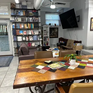 a table with chairs and books