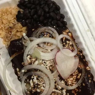 Chicken mole enchiladas (3) with rice and black beans. Chicken was dry and flavorless. I personally would not order again.