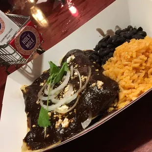 a plate of mexican food with rice and beans