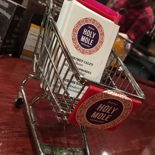 a shopping cart filled with books