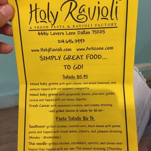 a person holding up a sign