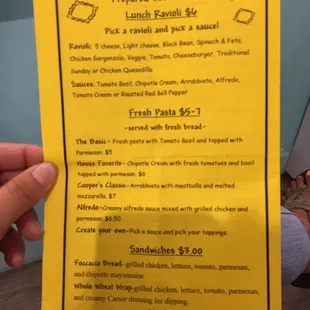 a person holding a menu