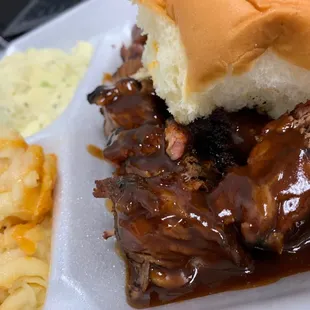 a pulled pork sandwich and macaroni and cheese