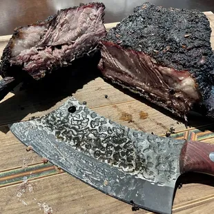a steak and a knife on a cutting board