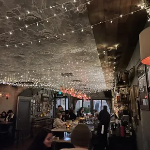 a row of wooden tables in a restaurant