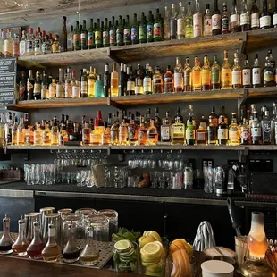 a bar filled with bottles of alcohol