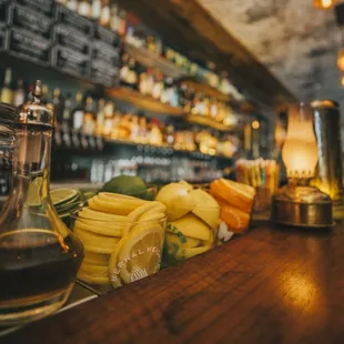 a bar counter with a variety of food items
