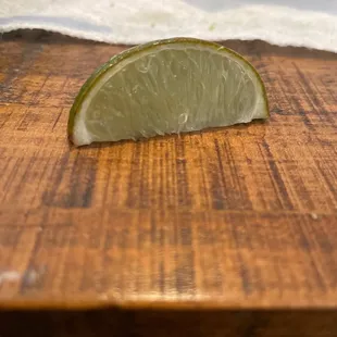 a slice of lime on a cutting board