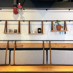 a row of chairs and shelves in a room