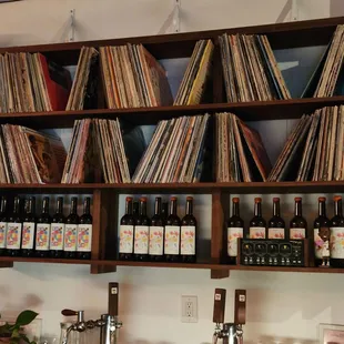 a collection of vinyl records on a shelf