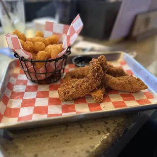 Chicken strips, tater tots .  Yum.