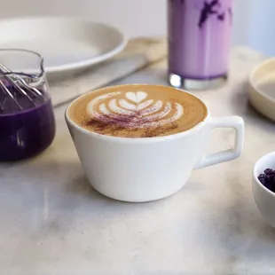 Ube Latte - A double shot of espresso mixed with homemade ube sauce and topped with ube powder