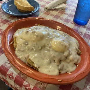 It&apos;s covered in gravy, but underneath are two eggs, chicken, fried steak, and hashbrowns. Very good and super filling!