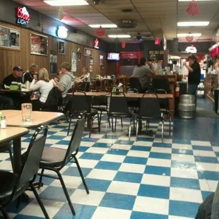 diners in a restaurant with checkered floor