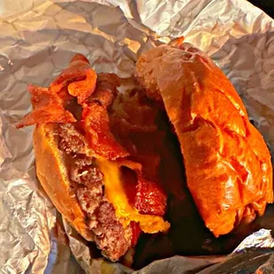 a sandwich wrapped in aluminum foil