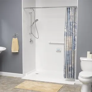 a bathroom with a shower, toilet and sink
