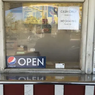 ows an open sign in the window