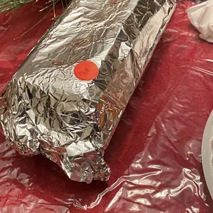 a sandwich wrapped in tin foil