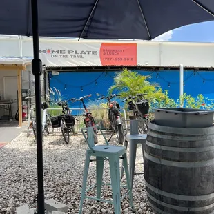 a patio area with chairs and an umbrella