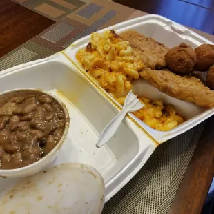 Butterfly Pork Chop mac-n-cheese and pinto beans  with hushpuppiees