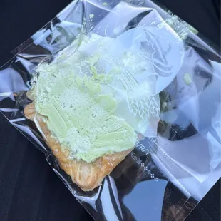 Melon cream tart in a tiny bag after being forcefully squished