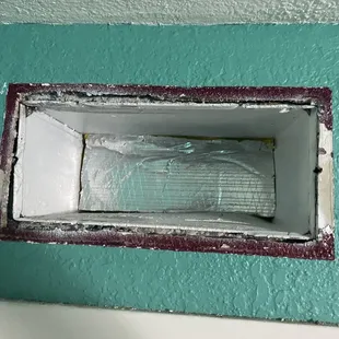 Stuffing insulation board to try and make the duct blow elsewhere