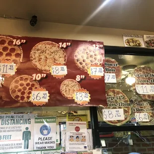 Size and prices of pizza. Ordering window has a plastic shield and owner was wearing a mask when taking my order.