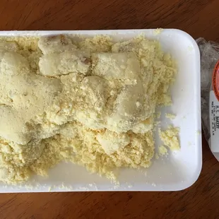 a plate of bread and a bag of milk