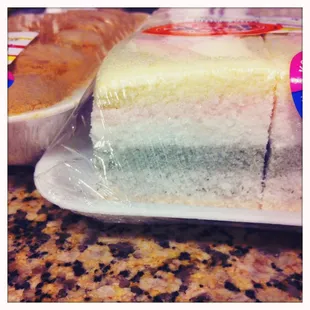 a slice of cake wrapped in plastic