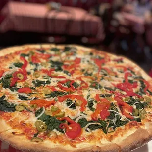 spinach, roasted red peppers, green olives, and onions