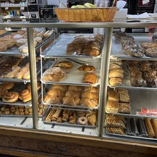 a display case filled with various types of donuts