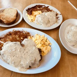 Chicken - fried Steak with scrambled eggs &amp; Hash Browns (lower); Full Order Biscuits And Gravy Meal with scrambled eggs &amp; bacon