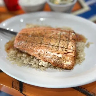 Salmon over bed of brown rice