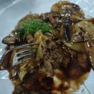 Delicious mouth watering savory veal stock reduction was perfect with the wild mushrooms and short rib stuffed raviolis.