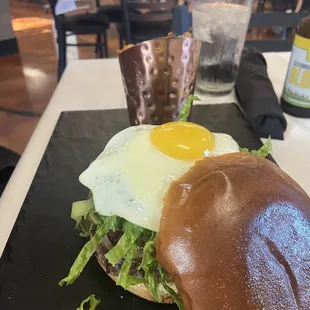 Burger with sunny side egg and caramelized onions! Delish and fries were crispy and Seasoned well!