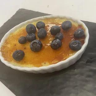 Vanilla crème brûlée with blueberry on top! Delicious! Nice crispy topping! Smooth and creamy not to sweet! Loved it