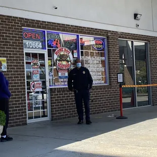 Police officer making sure the place doesn't get too crowded.