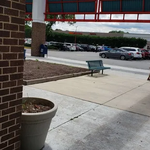 a woman walking down the sidewalk