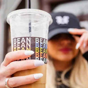 a woman holding a cup of coffee