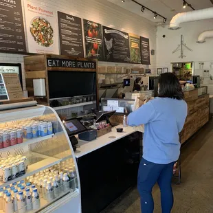 a woman ordering food at a store