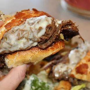 The tender braised beef was heaped onto the hearty roll of bread.