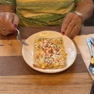 Homemade lemon pop tart. It was my Grandma's 99th birthday. Our server said all birthday girls get a pop tart!  She loved it.